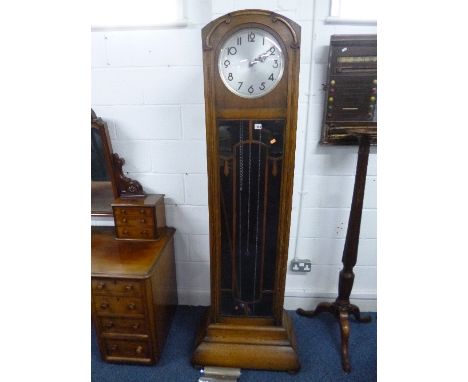 AN OAK LONGCASE CLOCK, with glazed door (pendulum and three chrome weights)