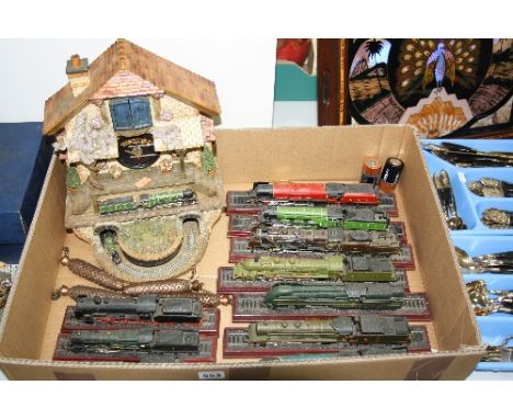 A FLYING SCOTSMAN CUCKOO CLOCK, together with ten model locomotives 'Duchess LMS', 'LNER Flying Scotsman', 'Pacific Chapelon 