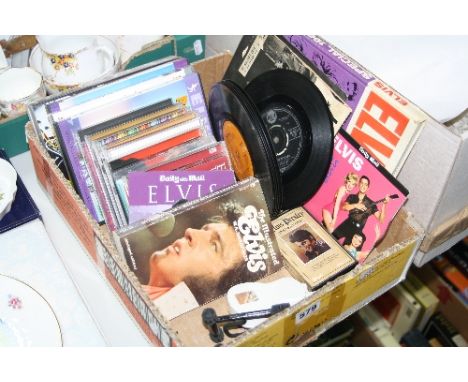 A TRAY OF ELVIS C.D'S, SINGLES, DVD'S AND VIDEO, including ten original singles