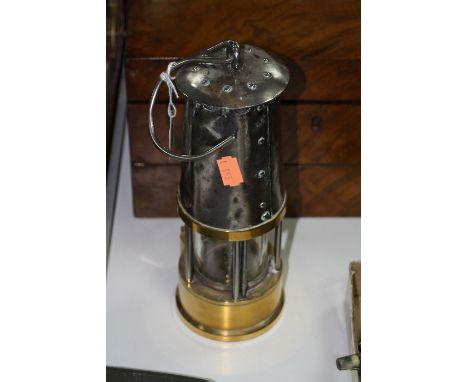 A BRASS MINERS LAMP, with plaque inscribed Protector lamp and lighting Type SL M & O Approval No.B/120