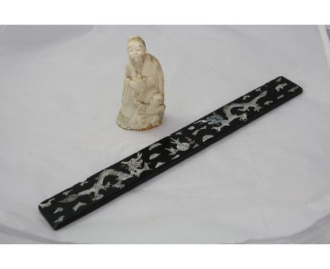 A VICTORIAN CARVED IVORY FIGURE OF MAN AND BOY, (a/f), together with a mother of pearl ruler (2)