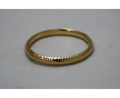A 9CT BANGLE, approximate weight 8.0 grams