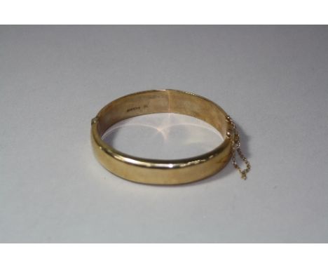 A 9CT BANGLE, approximate weight 16.4 grams