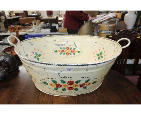 A twin handle enamel decorated bath