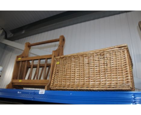 A pine magazine rack together with a wicker hamper