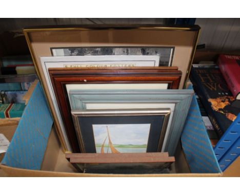 A box containing various prints