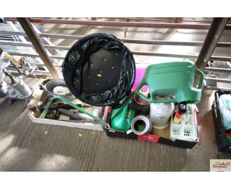 Two trays and contents of tools to include shoe lasts; hand saws; car jacks; collapsible garden basket; watering can; etc. 