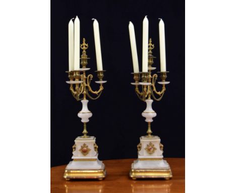 Pair of French alabaster and brass mount candelabra,&nbsp;the bases with applied lion mask and ring handles upon stepped gilt
