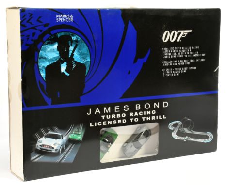 Slot cars - Carrera set James Bond turbo racing licensed to thrill to include Aston Martin Vanquish and Jaguar XKR as feature