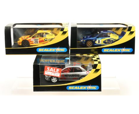 Slot cars - Scalextric Rally car group to include C2491 Subaru Impreza WRC Works 2003 race No.8, C2349 Mitsubishi Lancer Evol