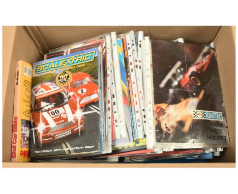 Slot cars - A large quantity of Slot car Scalextric magazines, also includes some anniversary manuals. Conditions are Fair to