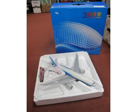 A Boxed Desk Display Static Model of a Boeing 787 Airliner, with plinth, damage/repair noted to wing mounted jet engine, wing