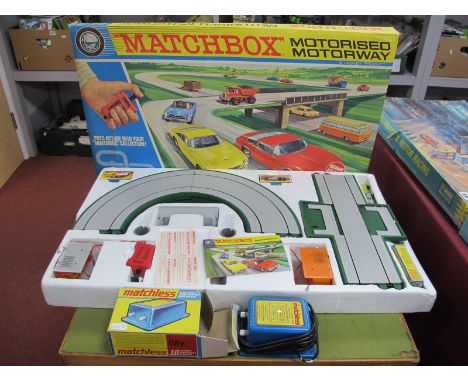 A Matchbox M-2 Motorised Motorway Set, comprising of nine Matchbox and similar diecast mode cars, track, controllers, literat