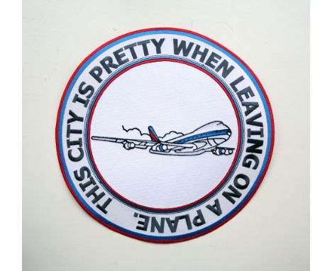 Adam Bridgland This city's pretty when leaving on a plane embroidered patch signed 30cm diameter cm unframed On show at the C