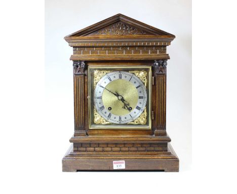 A circa 1900 German walnut cased mantel clock by Winterhalder &amp; Hofmeier, the silvered chapter ring showing Roman numeral