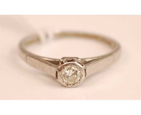 A platinum and diamond solitaire ring, the illusion set brilliant weighing approx 0.1ct, 2.6g, size J/K