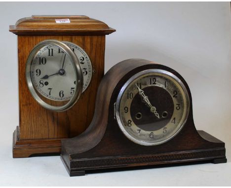 An early 20th century oak cased eight-day mantel clock, the silvered chapter ring showing Arabic numerals, h.22cm; together w