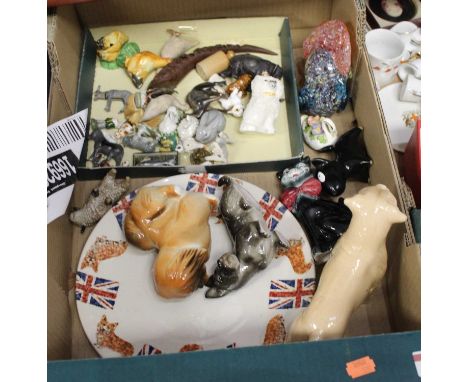 A box containing a collection of various ceramic and glass animal figures, to include a Staffordshire spaniel