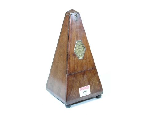 An early 20th century French walnut cased metronome of obelisk form, height 23cm  