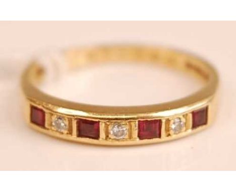 A modern 18ct gold ruby &amp; diamond set half eternity ring, the three small brilliant cut diamonds, each weighing approx 0.