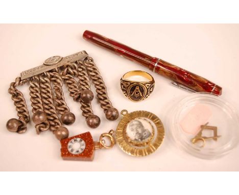 A Masonic yellow metal pendant; together with a Masonic gilt metal ring; a Martin Luther King gilt metal swivel pendant; foun