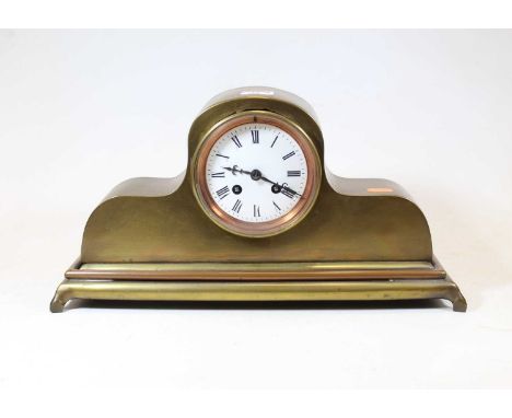 A late 19th century brass cased mantel clock, the enamelled dial showing Roman numerals, the eight-day movement striking on a