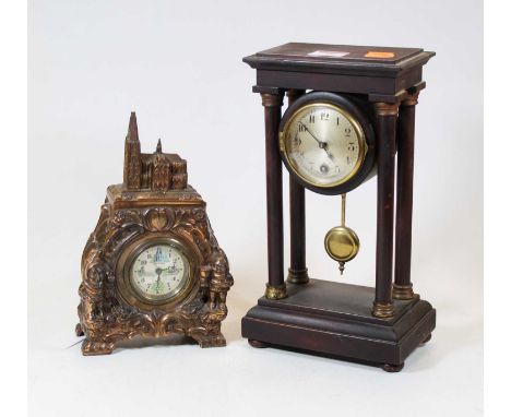 An early 20th century portico clock, the silvered dial showing Arabic numerals, 27cm high, together with a 20th century repou