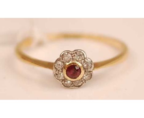 An Art Deco 18ct gold, ruby and diamond flower head cluster ring, 1.9g, size P