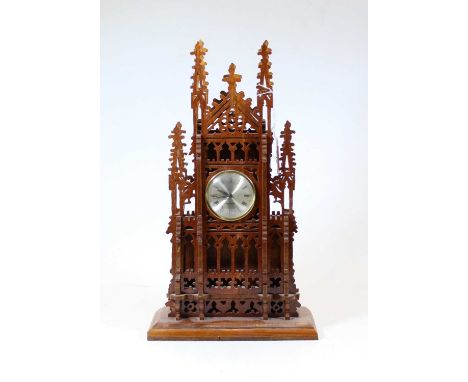 A 20th century fret-carved mahogany quartz Cathedral clock, of architectural form, with crocket and quatrefoil decoration, h.