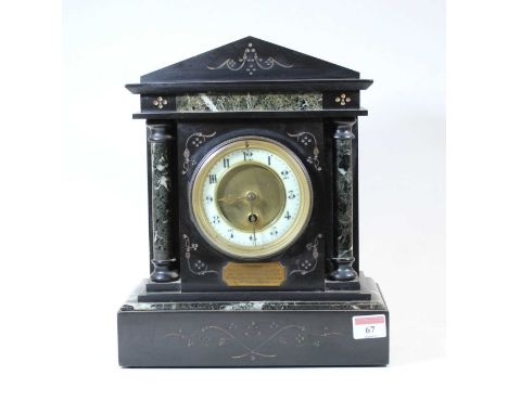A Circa 1900 black slate mantel clock, of architectural form, the enamelled chapter ring showing Arabic numerals flanked by D
