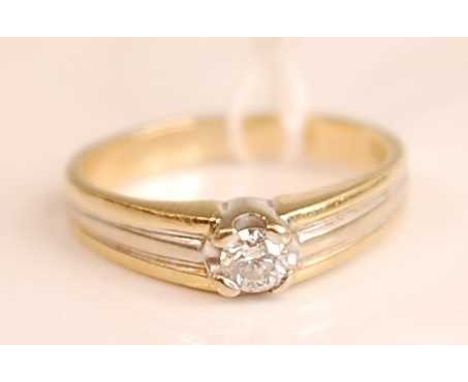 A 14ct two colour gold diamond solitaire ring, the claw set brilliant weighing approx 0.14ct 3.7g, size K/L