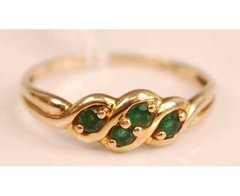 A modern 9ct gold emerald set dress ring, the round cut emeralds each weighing approx 0.07ct, 1.4g, size Q