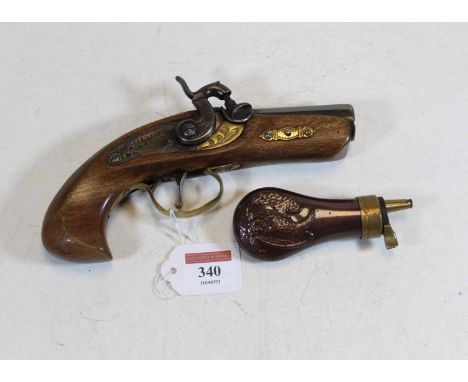 A reproduction percussion cap pistol, the lock stamped Derringer Philadelphia, length 20cm; together with a copper powder fla