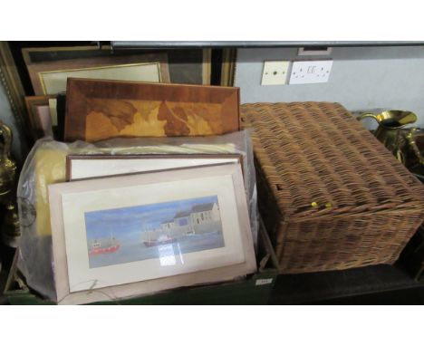A collection of prints, magazines and a wicker hamper