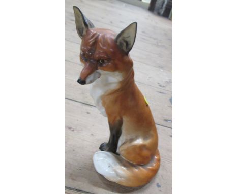 A Royal Worcester model, of a seated fox