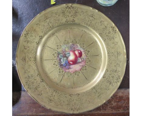 A Royal Worcester cabinet plate, decorated to the centre with fruit by Skerrett, with large acid etched border