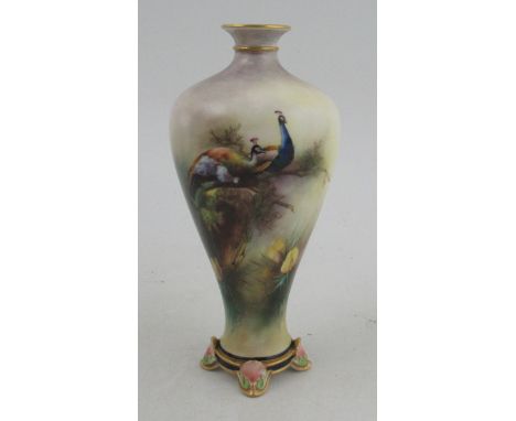 A Hadleys Worcester vase, decorated with nesting peacocks, height 7ins