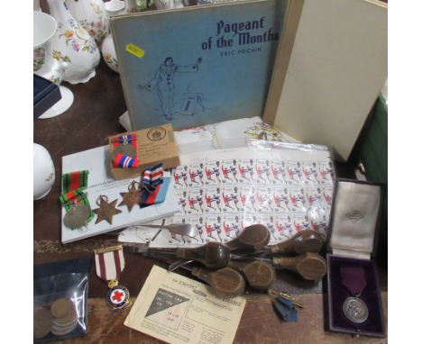 A collection of items, to include two books, a embroidered table cloth, war time service medals, World Cup 1966 England Winne