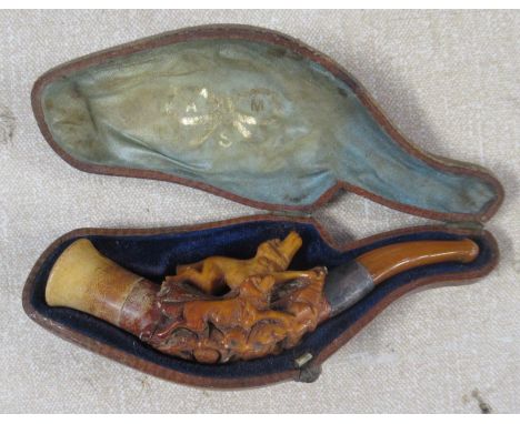 A cased carved Meerschaum pipe, carved with two dogs