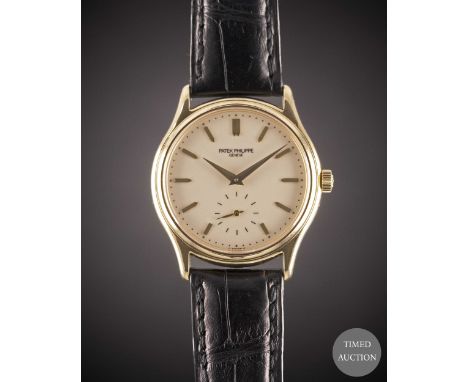 A GENTLEMAN'S 18K SOLID GOLD PATEK PHILIPPE CALATRAVA WRIST WATCH
DATED 1993, REF. 3923 WITH PATEK PHILIPPE BOX &amp; EXTRACT