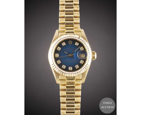 A LADIES 18K SOLID GOLD ROLEX OYSTER PERPETUAL DATEJUST BRACELET WATCH
CIRCA 1985, REF. 69178 WITH ORIGINAL DIAMOND SET BLUE 