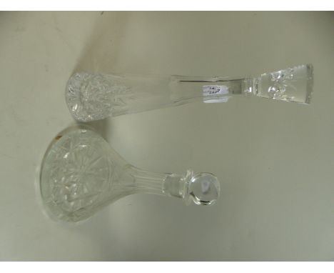 A Cut Glass Ships Decanter and a Tall Decanter