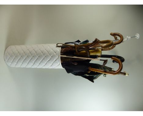 A Ceramic Stick Stand Containing Various Umbrellas, Parasols etc