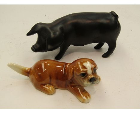 A Royal Dux porcelain Piglet in matt black together with Goebel Puppy