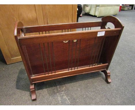An early 20th Century mahogany trough magazine rack
