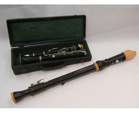 A large recorder and a cased clarinet