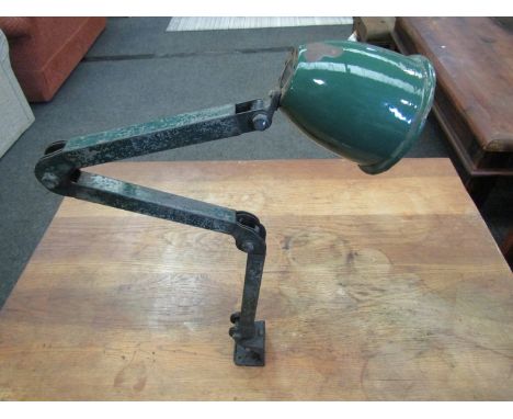 An industrial metal adjustable lamp with enamel shade