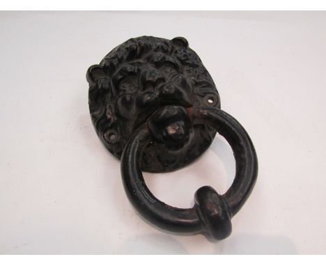 A 1930's reclaimed cast iron lions head door knocker in black