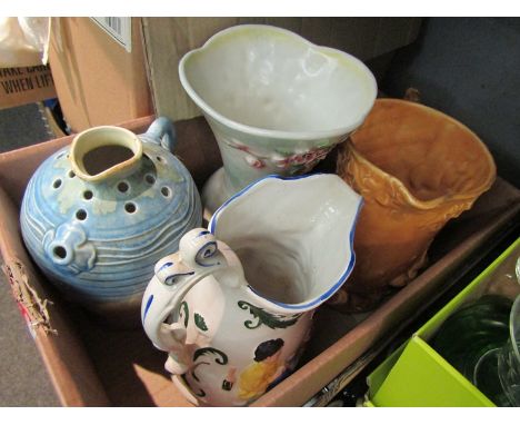 A box containing three jugs with flora/fauna decoration incuding Wade and a Sylvac vase