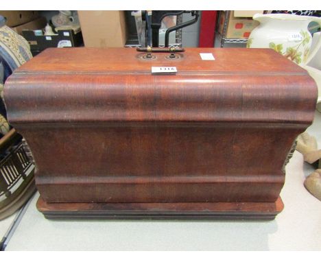 A manual Singer sewing machine, walnut cased